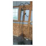 Three shepherds hooks and two suet feeders