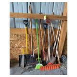 Long handled yard tools and brooms as shown