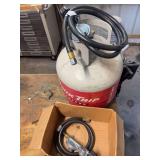 LP tank, maybe 1/2 full, gas regulators and hoses