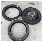 3 motorcycle tires, one on rim has large bulge in tire 110/70-17 and GS11-AW