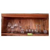 Clear glass includes Pioneer Woman glasses, individual ashtrays, etched candle holders, single Waterford wine glass, other stemware and marmalade dish