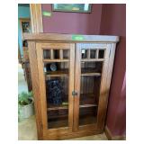 Modern oak cabinet with three shelves, does have a small hole in the back It was a media cabinet in it's previous life NO CONTENTS!