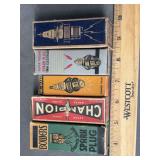 5 antique boxed spark plugs as shown