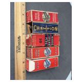 5 antique boxed spark plugs as shown