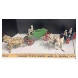 2 cast iron horse drawn wagons