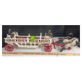 Cast iron ladder wagon with 3 horse hitch