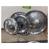 2 Chevy hub caps and Chrysler hubcap clock