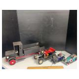4 tin toy trucks