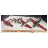 4 pressed tin airplanes