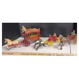 3 cast iron horse drawn wagons one is cast and tin