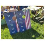 Portable cornhole boards and two metal corn garden decor stakes