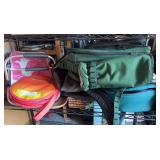 Shelf full of picnic items, including full picnic backpack, and Pyrex dish with Carrying case