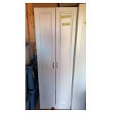 White two door cupboard with shelves
