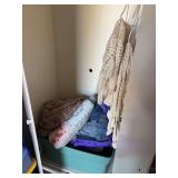 Contents of cupboard includes quilted comforters, denim quilts, unique brand blanket