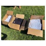 Three boxes of new cotton T-shirts, white, black, and gray very sizes from medium to 2XL