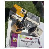 Small crockpot, fondue set, coffee grinder, knife set and large box full of plastic forks