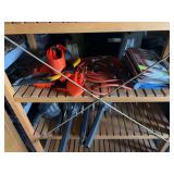 Estwing hammer, assortment of Idaho license plates, solar yard lights, lifting belts, extension cord, small saw