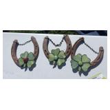 Three lucky horseshoes with stained glass four leaf clovers