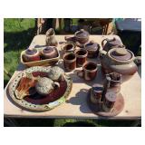 Large assortment of brown pottery