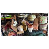 Outdoor decor lot includes 2 bird houses with license plate roofs, some small pots, garden decor, wind chime