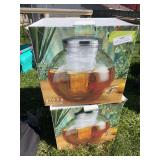 Two globe glass beverage dispensers