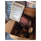 Large box of home decor, including baskets, vases, signage