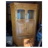 Oak corner cabinet with glass doors on top and two lower sections of cabinets (alternate location downtown - pickup will be arranged)