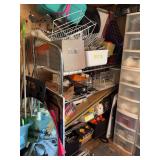Unique metal shelving unit with two shelves, full of baskets, bins, trays, and various storage items (top two shelving contents are included)