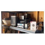 Contents of electronics shelf - includes two printers, room heater, sound equipment, home video cameras, CD player, sound bar