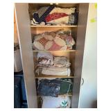 Quilts comforters etc - entire contents of cupboard, new and used