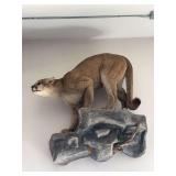 Crouching mountain lion full body mount on rock