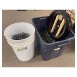 Coat and bucket full of pegboard hooks