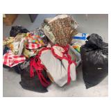 Various linens, pillows, batting, sheets, plastic table covers, sleeping bags