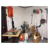 Corner full of treasures - includes life vests, hanging planter baskets, light fixtures, restaurant table, baseboard heaters