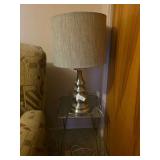 Lamp on small metal end table