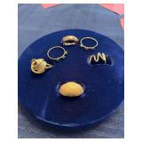 Six unmarked rings