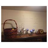 Metal ornaments on stand, basket, mantel clock, candle holders