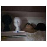 Two mannequin heads, two hats