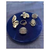 Six unmarked rings