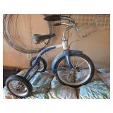Antique pedal tricycle with basket