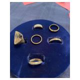 Six unmarked rings