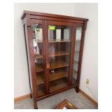 Display cabinet w single  glass front door and glass sides 16D x 42L x 62H