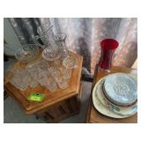Several pieces clear glass with butterfly and floral design, plates, red vase