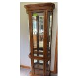 Lighted curio cabinet w glass shelves and two doors, curved sides 12D x 29L x 76H