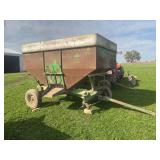 Husky gravity wagon on a green running gear, front hub and bearings are out, we have the tire