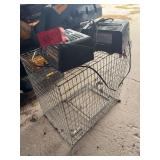 Two battery chargers and an animal cage