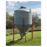 Bulk Bin W/4" auger, needs a new motor, the top has been caved, 70" round and two rings High 4 ft plus the cone.