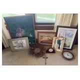 Various pieces of wall art and clocks