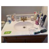 Beauty supplies, hair clips, waterpik, etc