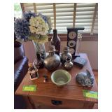 Home decor includes Galileo thermometer, vases, figurines